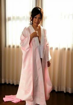 Japanese solo girl slips off her robe to reveal her nice boobs in white socks - Japan on picsfans.one