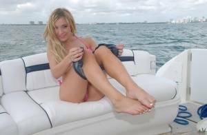 Lusty blonde Amy Brooke strips bikini and rubs pussy on the boat on picsfans.one