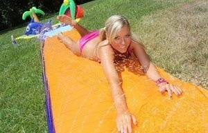 Young blonde Ally Kay ends a water fight by having sex in backyard on picsfans.one