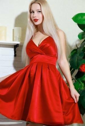 Nice blonde teen Genevieve Gandi removes red dress to display her trimmed muff on picsfans.one