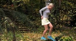Cute blonde Victoria Pure hikes her skirt to take a pee along country lane on picsfans.one