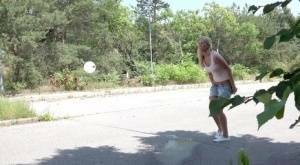 Blonde female Nikki Dream can't hold her pee any longer and squats on roadway on picsfans.one