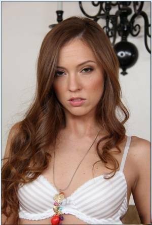 Pretty babe Maddy O'Reilly stripping and exposing her shaved slit on picsfans.one