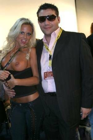 Blonde MILF Silvia Saint fully clothed posing & flaunting big tits at party on picsfans.one